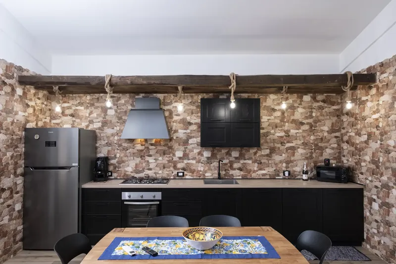 Sitting area with a games table and exposed stone