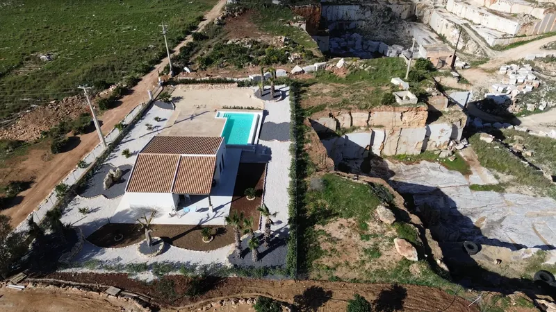 Aerial view of the villa and its pool