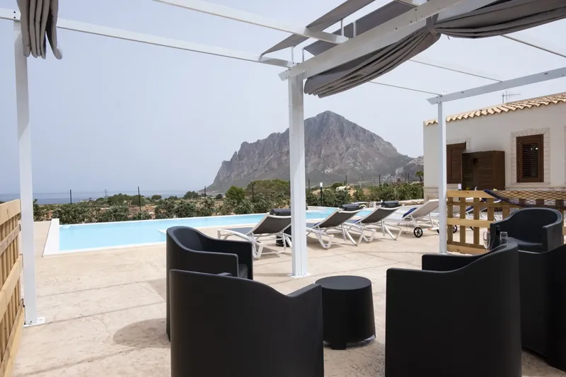 Poolside loungers with the sea on the horizon