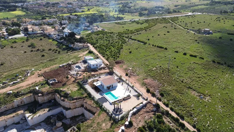 The villa and pool with Monte Cofano behind